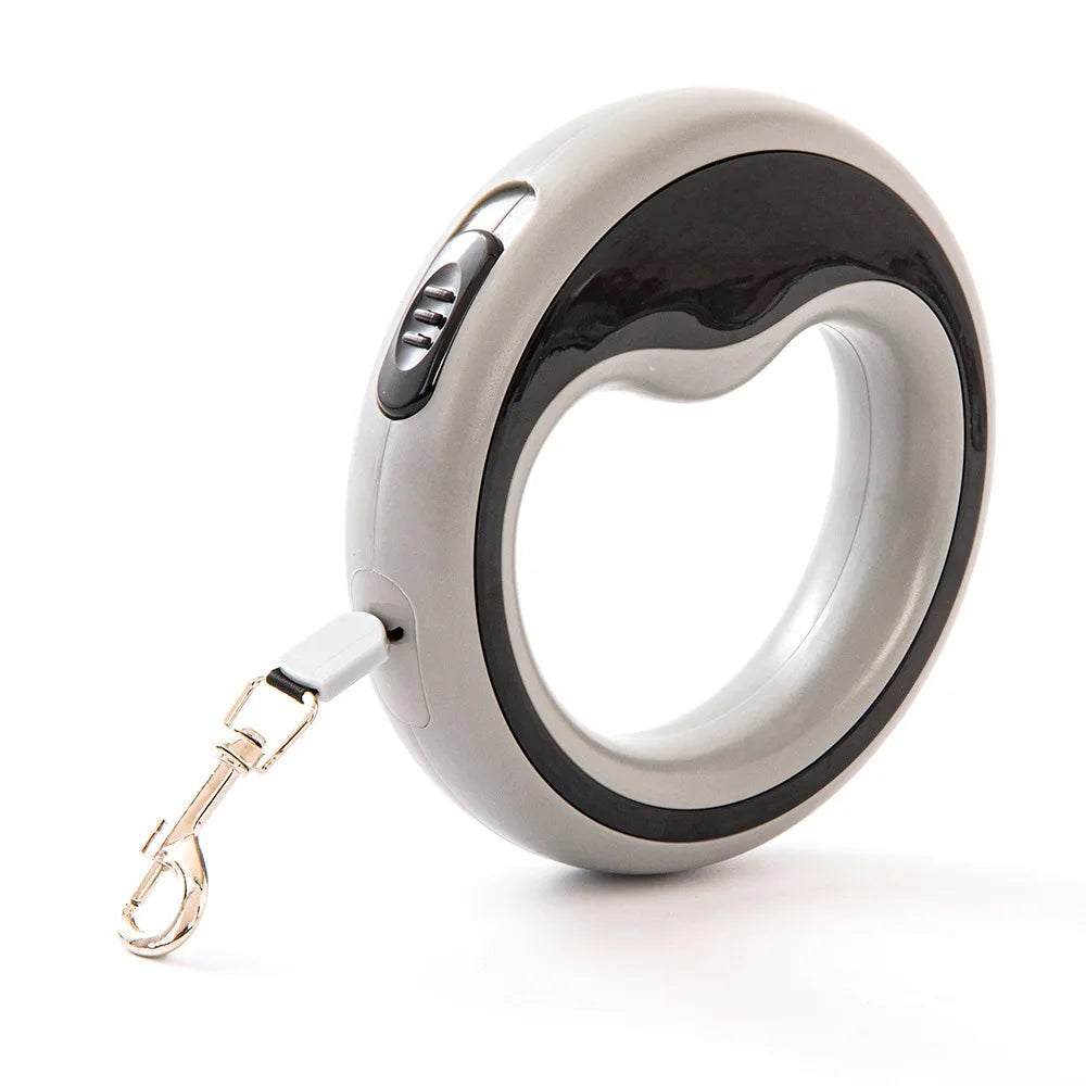 White and black pet retractable leash on a white background