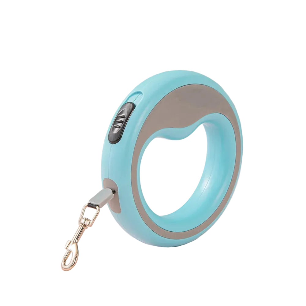 Light blue retractable dog leash on a light pink surface with a light blue wall background