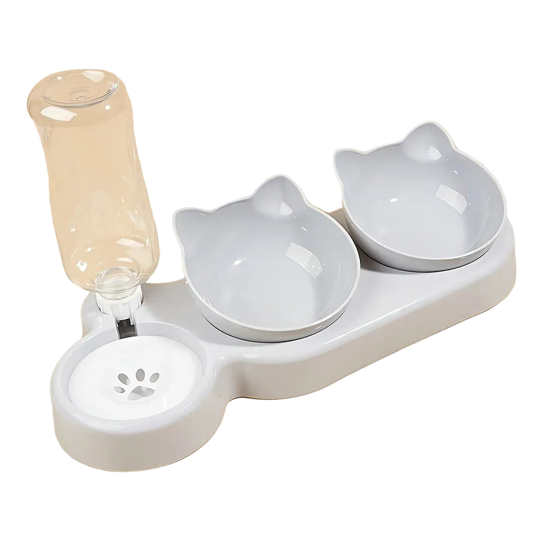 Pet water fountain with two ceramic bowls shaped like cats on a beige background